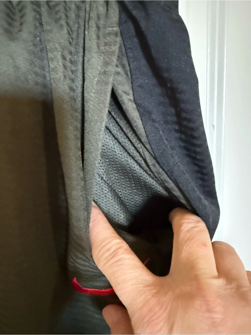 Nike Men's Olive Green Athletic Shorts with Black Panels and Red Swoosh